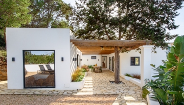 Resa Estates Ibiza villa for sale es Cubells modern heated pool house side.jpg